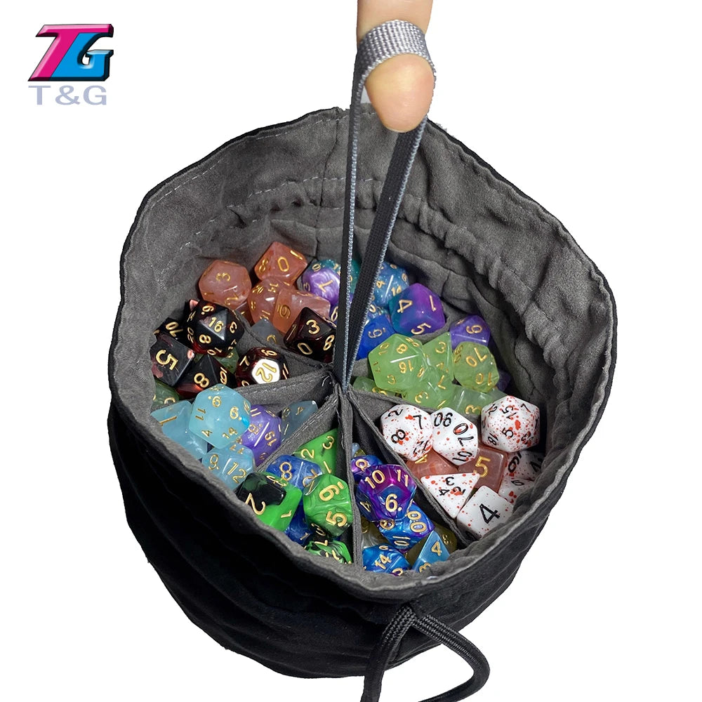 A dark gray velvet pouch with a drawstring opening filled with various colored dice.