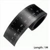 A black magnetic flexible measuring ruler showing a scale marked in inches and centimeters.