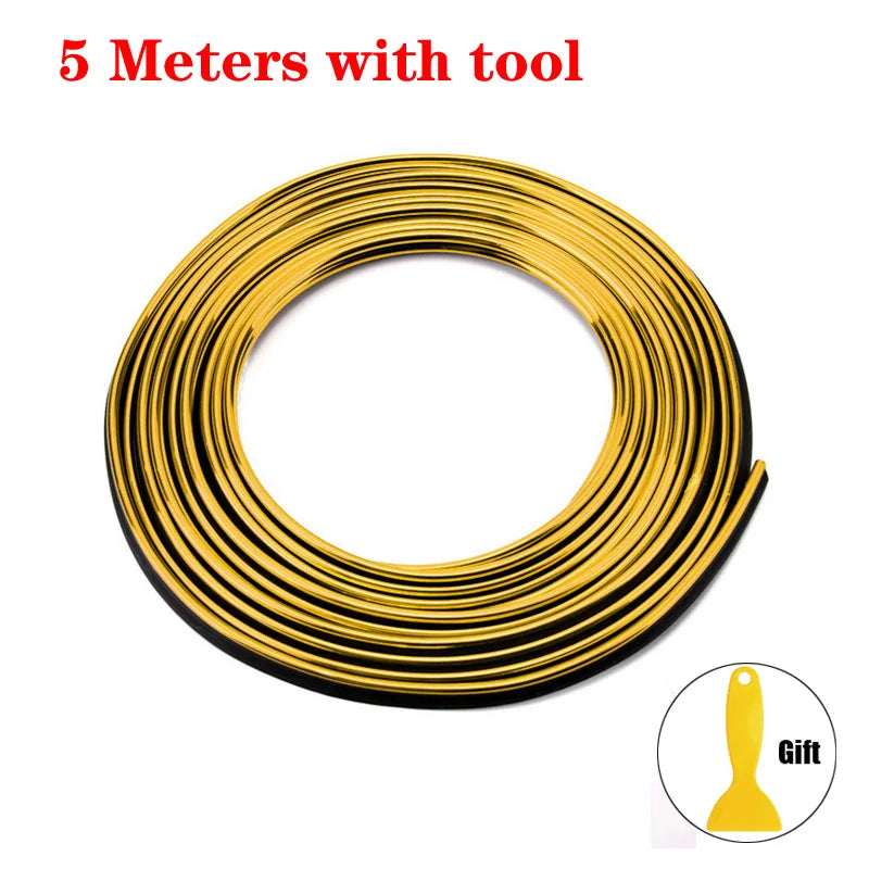A coil of 5 meters of gold-colored flexible car interior trim strips with a tool.