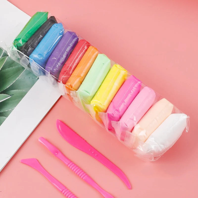 A collection of 36 colored clay tools and modeling items packaged in a clear plastic bag on a pink background.