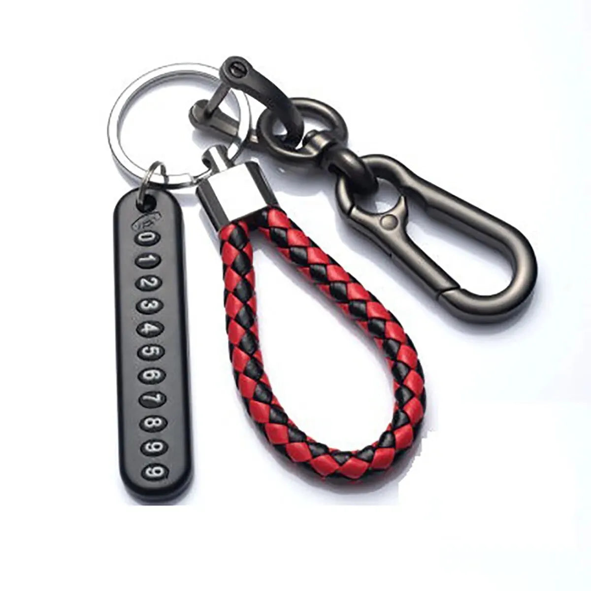 A black metal keychain featuring a personalized phone number and a braided red and black leather rope.