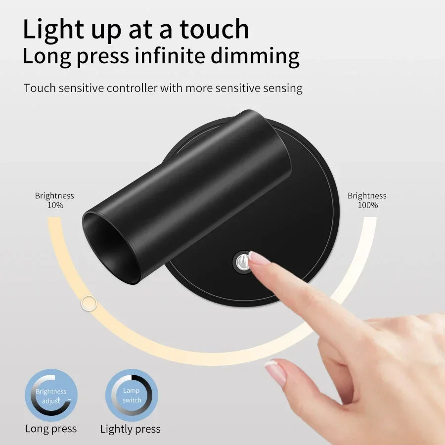 A hand touches a black magnetic rechargeable light switch to adjust the brightness of a lamp.