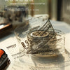A clear glass jar filled with decorative PET washi tape featuring a mottled collage design and vintage paper elements.