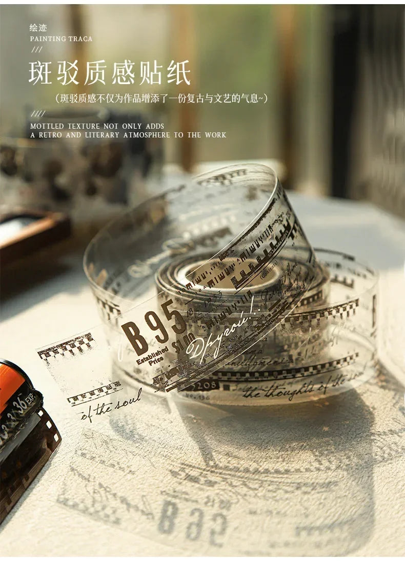 A clear glass jar filled with decorative PET washi tape featuring a mottled collage design and vintage paper elements.
