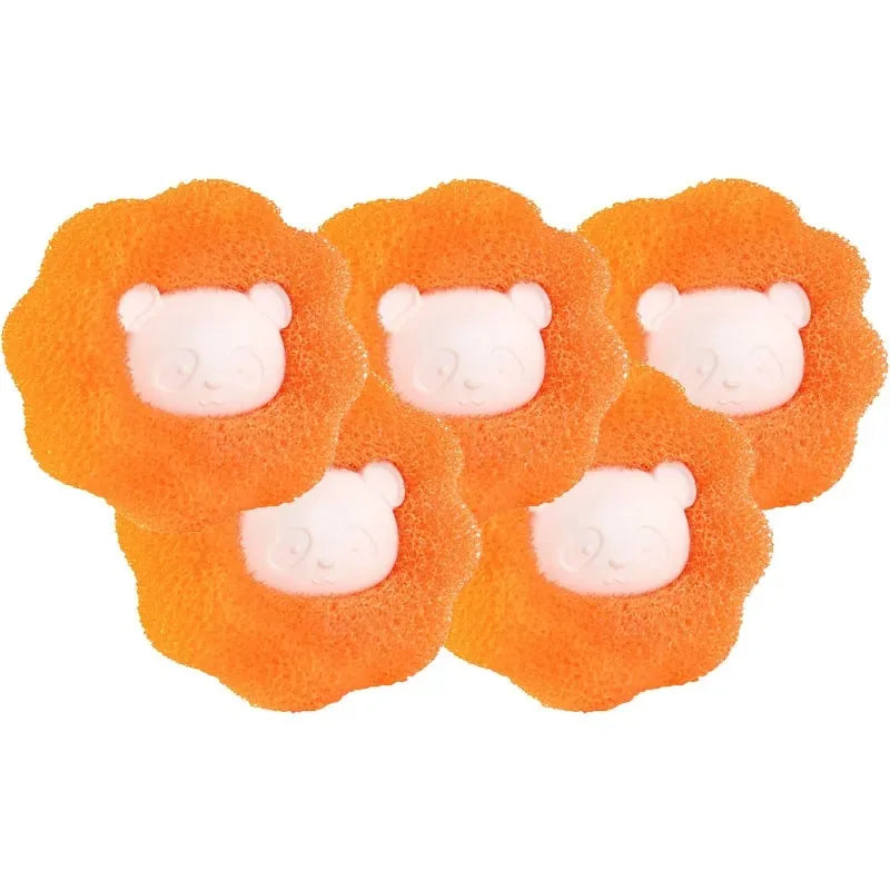 A set of orange, porous laundry balls designed for removing pet hair and lint.