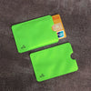 A bright lime green RFID blocking card sleeve is shown next to an orange ID card.