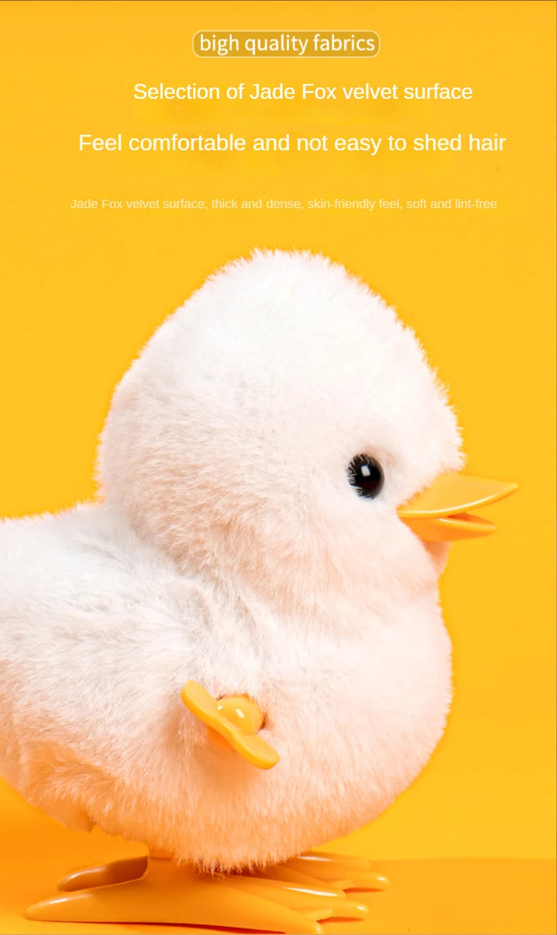 A white jade fox velvet surface wind-up walking chicken toy with yellow feet.