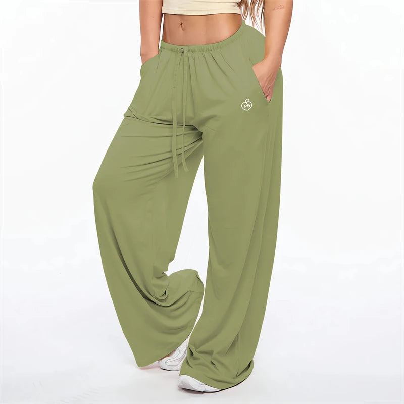 Olive green flare leggings with a drawstring waist and a small logo detail