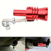 A red turbo sound whistle attached to a metal clamp, shown in close-up against a dark exhaust pipe.