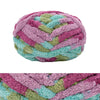 A ball of chunky chenille yarn in shades of pink, purple, and green.