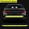 Rear view of a car with fluorescent green light strips installed on the lower bumper.