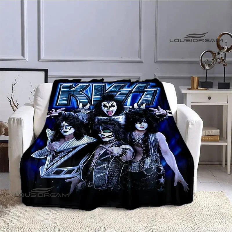 A black flannel throw blanket featuring a graphic print of the KISS band members.