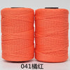 Two spools of orange 3-ply polyester knitting yarn for crochet and hand crafts
