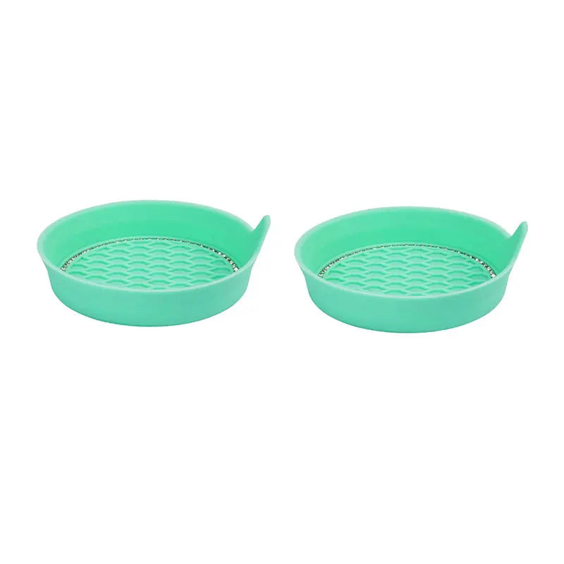 A pair of teal silicone car cup holder coasters with a textured surface and a rhinestone rim.