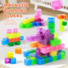 A colorful collection of transparent magnetic building blocks stacked and scattered on a white surface.