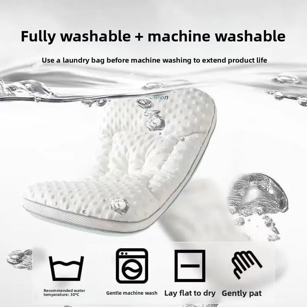 A white reversible breathable baby pillow shown with laundry instructions and care symbols.