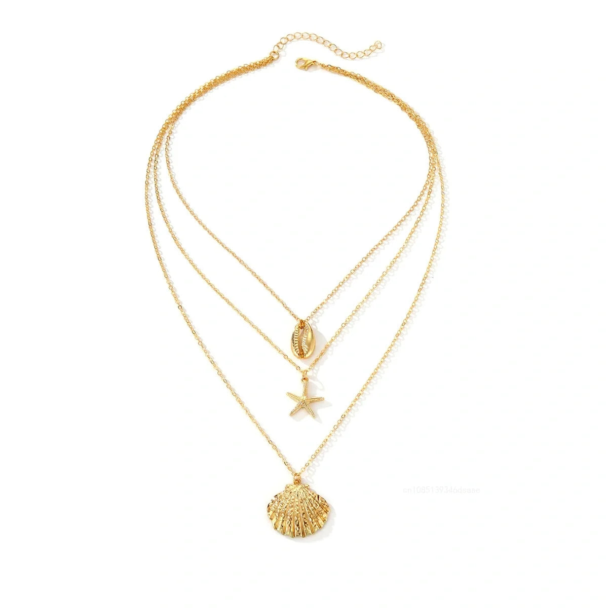 Gold layered necklace featuring a heart and star pendant on a delicate chain.