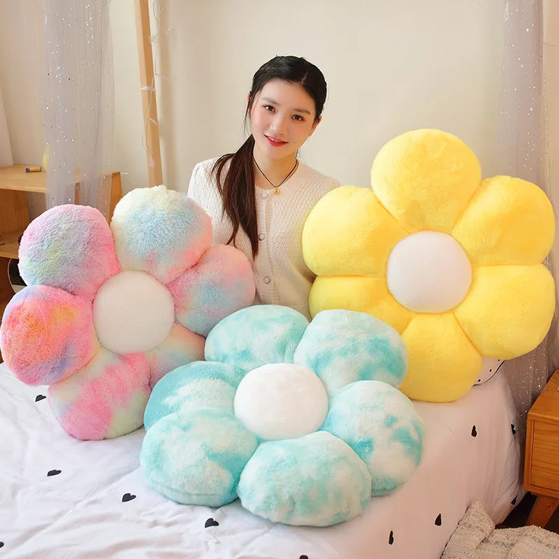 A collection of yellow and light blue sunflower-shaped plush pillows with soft fur texture displayed on a white surface.