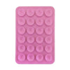 A pink reusable silicone suction cup phone mount for hands-free viewing with multiple suction cups.