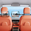 An adjustable tablet holder is mounted on a car headrest, displaying a digital clock.