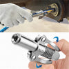 A hand is using a heavy-duty grease gun coupler to connect or disconnect a syringe from a tool.