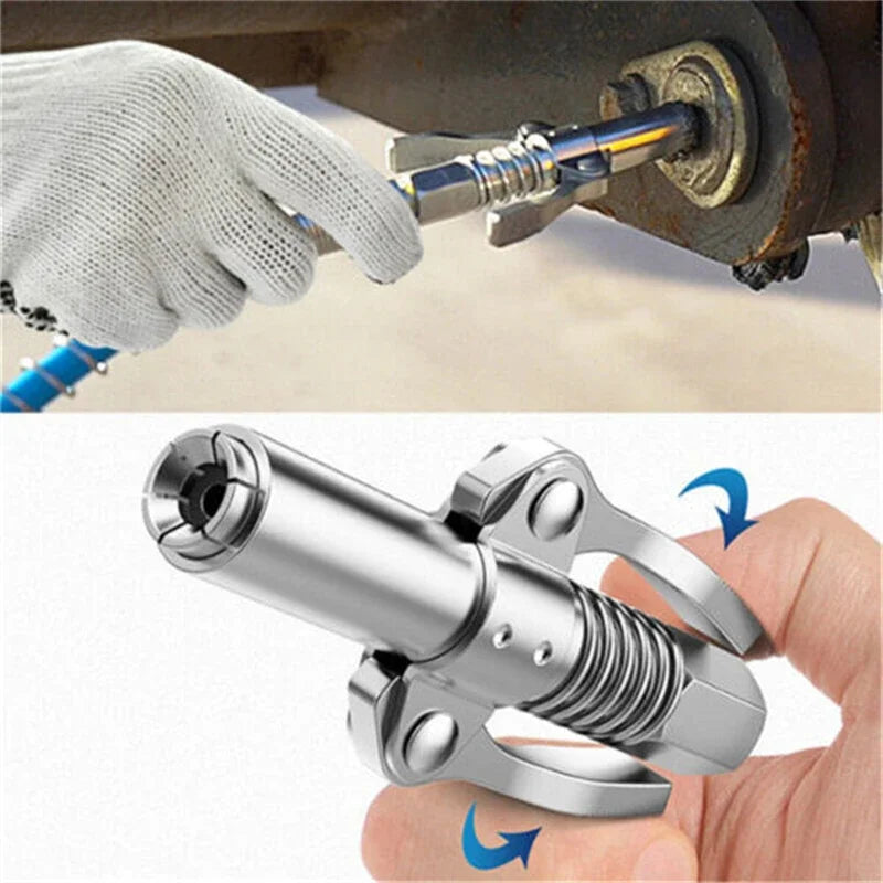 A hand is using a heavy-duty grease gun coupler to connect or disconnect a syringe from a tool.