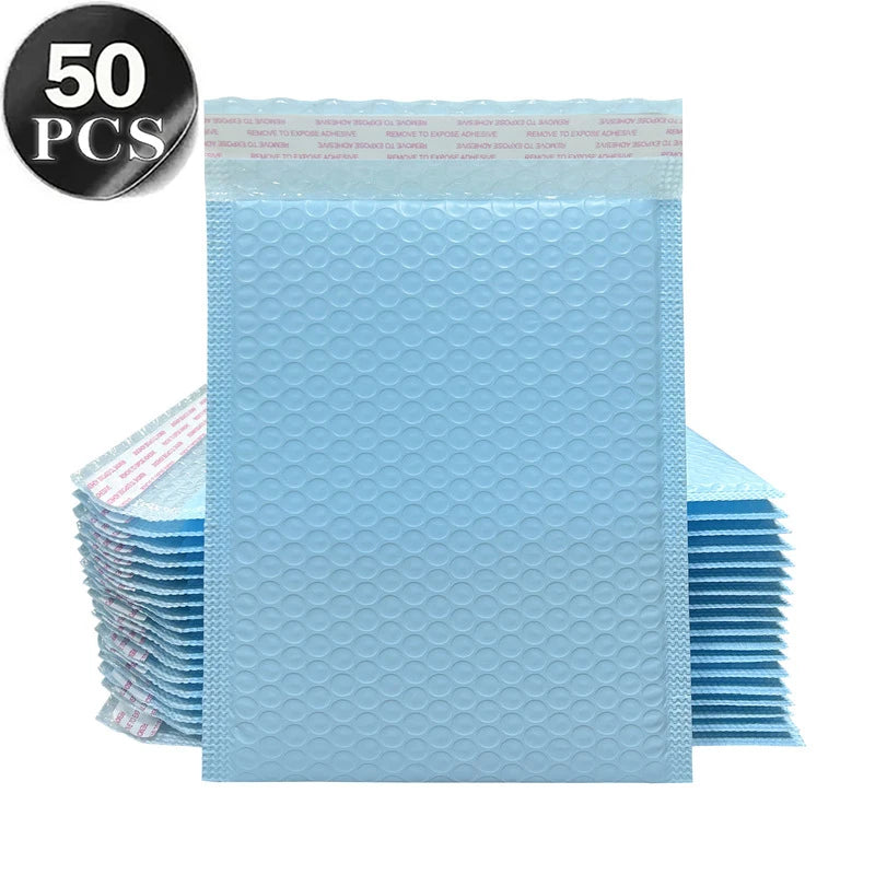 A stack of 50 opaque light blue bubble mailers with self-sealing adhesive.