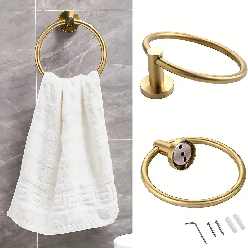 A set of four stainless steel bathroom accessories including a toilet paper holder, towel ring, and hooks.