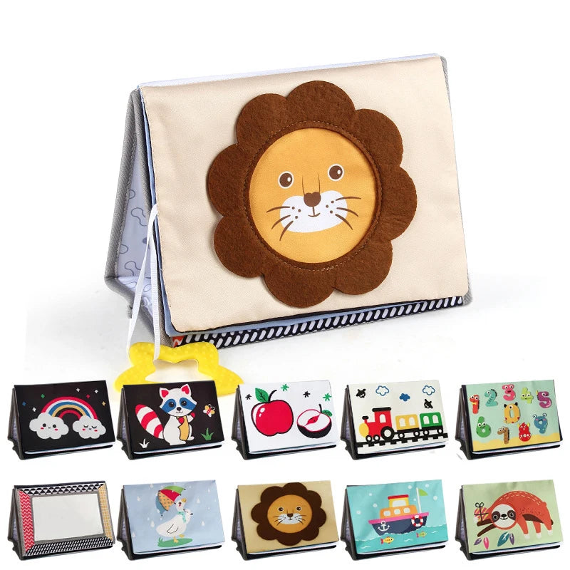 A high-contrast crinkle cloth book with a lion design and a tummy time mirror for babies.