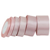 Roll of light pink satin ribbon measuring one inch wide and twenty-five yards long