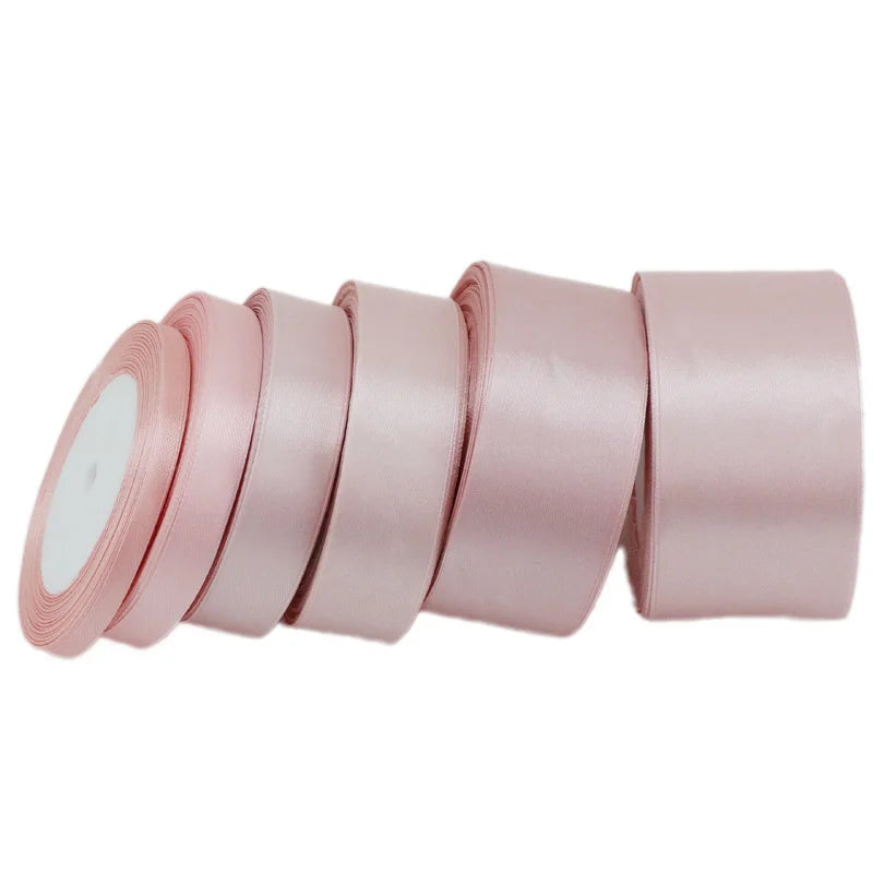 Roll of light pink satin ribbon measuring one inch wide and twenty-five yards long