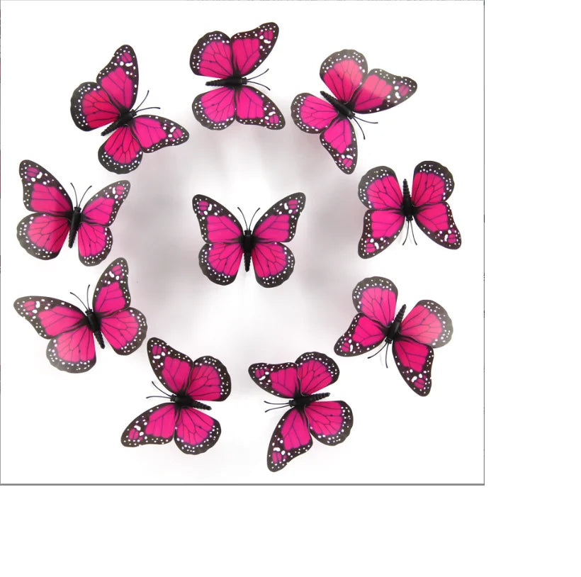 A circular arrangement of ten vibrant pink and black monarch butterfly magnets