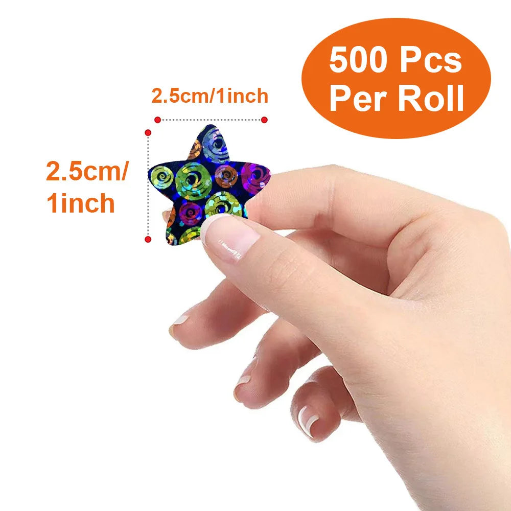 A hand holds a roll of 500 glitter star stickers for crafts and gifts.