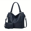 A dark navy blue PU leather tote bag with a detachable crossbody strap shown from the front.