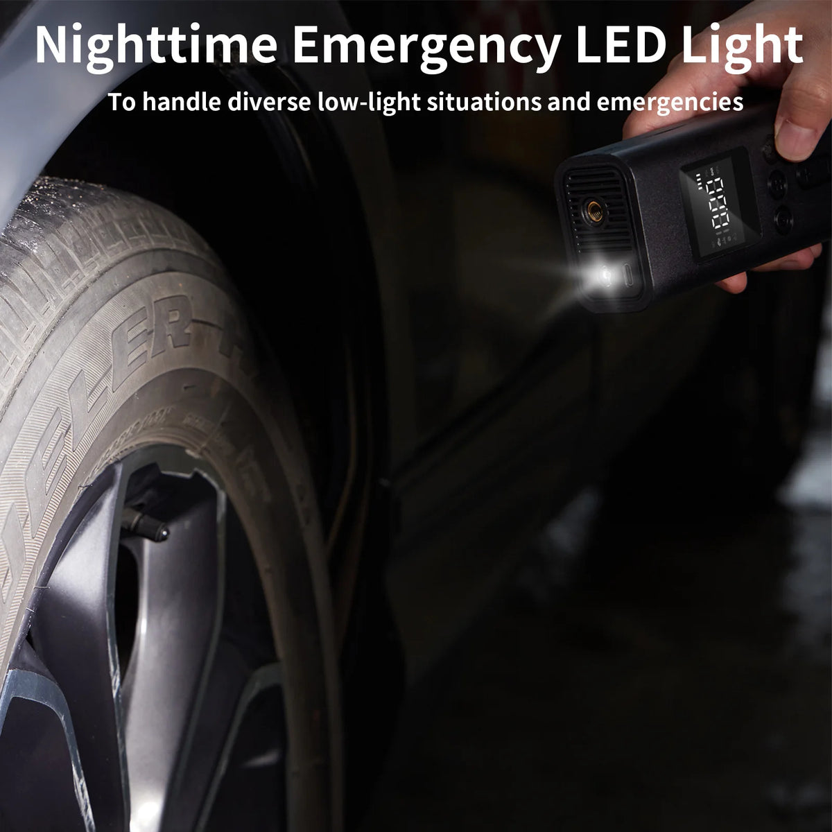 A hand holds a portable digital tire inflator with an LED light shining onto a car tire.