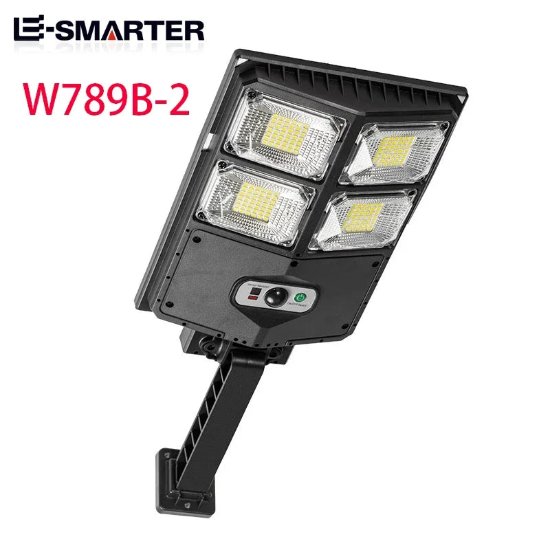 Black motion-activated solar garden light with three LED floodlights and a mounting bracket
