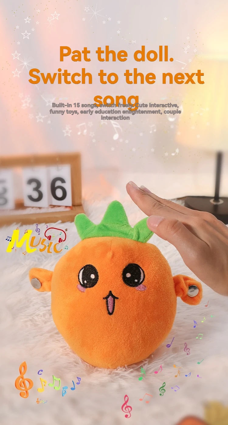 An orange fruit-shaped plush toy is being gently touched by a hand, set against a soft, white background.
