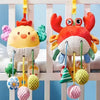 A colorful hanging crab sensory toy with rattles and teethers for babies, featuring bright orange and yellow textures.