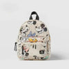 A beige and white patterned backpack featuring Mickey Mouse graphics and a cow print design.