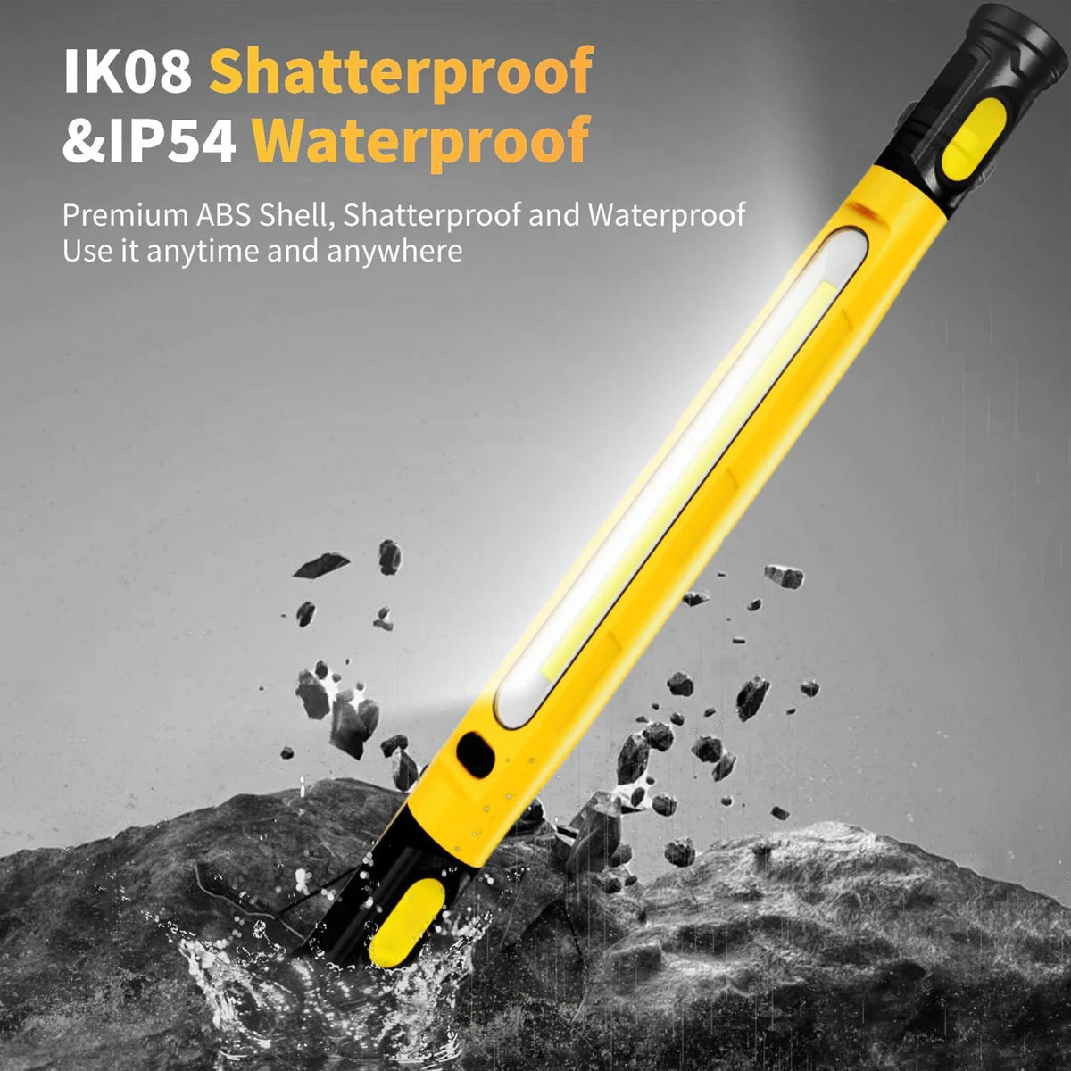 A yellow and black shatterproof IP54 waterproof LED work light is shown illuminating a rocky surface.