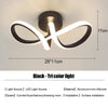 Black tri color light modern clover LED ceiling fixture with a curved, stylized design.