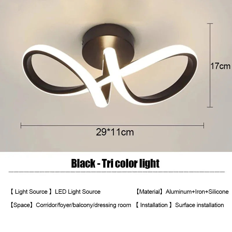 Black tri color light modern clover LED ceiling fixture with a curved, stylized design.