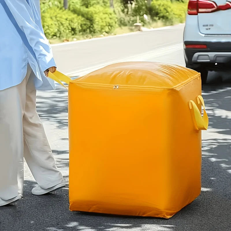 A bright yellow heavy-duty waterproof moving bag is being carried by a person on an asphalt road.