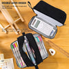 A black double-layer fabric pencil case is shown open, revealing multiple pens and stationery inside.