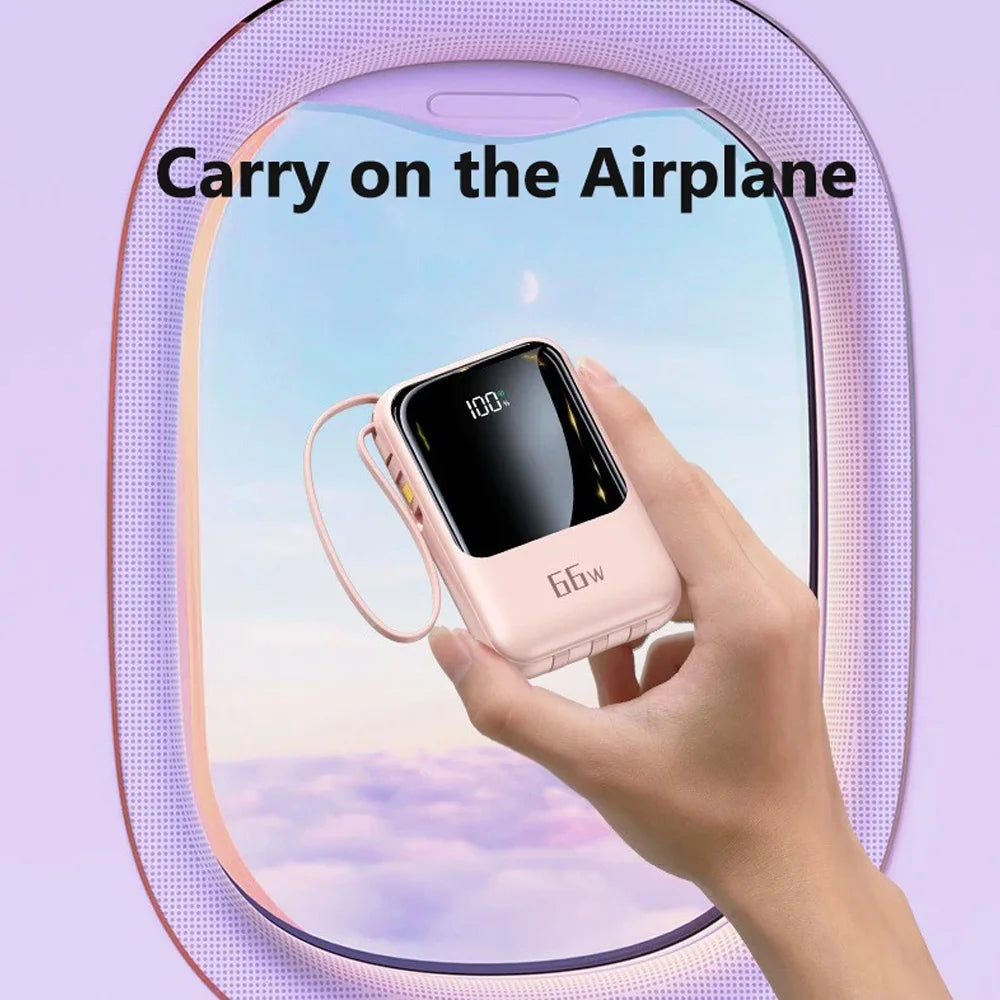 A hand holds a pink portable power bank with a cable and flashlight, set against a blurred sky background.