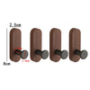 A set of four dark brown walnut wood hooks with round black mounting pieces for organization.
