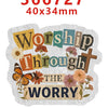 A white acrylic hair bow decoration featuring text that reads Worship Through The Worry with floral and cross elements.