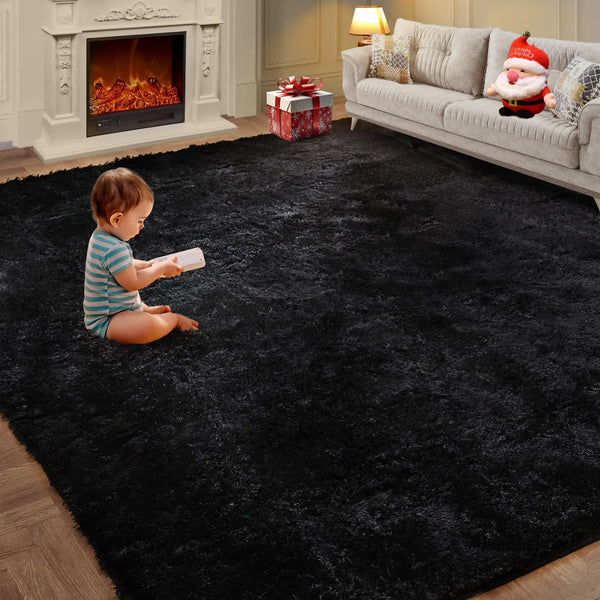 A small child sits on a black shaggy living room rug in front of a light-colored sofa and fireplace.