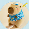 A light brown plush toy resembling a bear wearing a blue and white patterned shirt and a white hat.