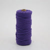 A spool of purple macrame cord, 3mm/4mm thickness, used for crafting.